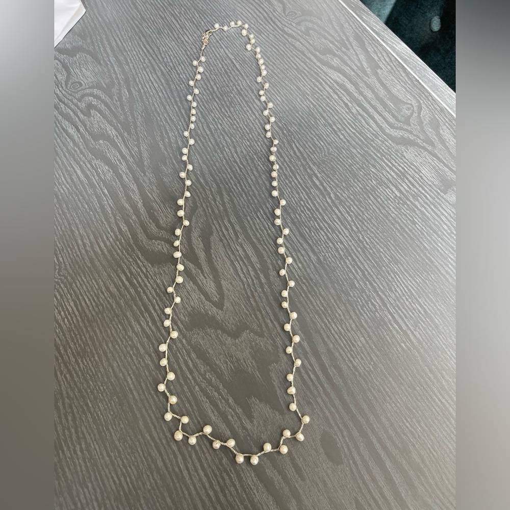 Long pearl station necklace
